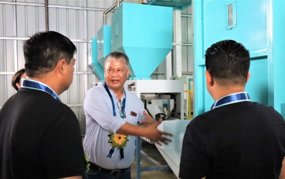 POST-HARVEST FACILITY. Philippine Center for Postharvest Development and Mechanization (PHilMech) Director III Joel V. Dator (center) shows the post-harvest facility which was turned over to the local government of Baliuag, Bulacan on Wednesday (Oct. 11, 2023). PHilMech has partnered with local government units in Central Luzon for the establishment of rice processing facilities under the Rice Competitiveness Enhancement Fund (RCEF) mechanization program. (Photo courtesy of PHilMech)